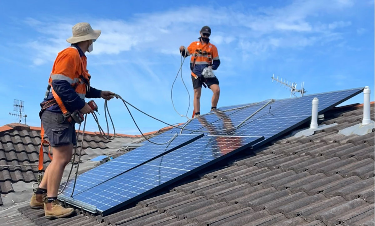 Lumapower solar installers on roof